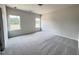 Spacious bedroom with two large windows, neutral walls and neutral carpet at 253 Deodora Ln, Cameron, NC 28326