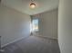 Cozy bedroom with carpet flooring, neutral walls, and a window offering pleasant outdoor views at 253 Deodora Ln, Cameron, NC 28326