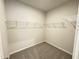 Walk in closet with neutral walls, wire shelving, and neutral carpet at 253 Deodora Ln, Cameron, NC 28326