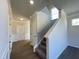 Welcoming entryway with a staircase, wainscoting and neutral paint, creating a warm first impression at 253 Deodora Ln, Cameron, NC 28326
