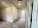 Upstairs hallway with neutral carpet leading to the bedrooms and bathroom at 253 Deodora Ln, Cameron, NC 28326