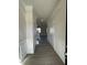 Inviting hallway with wainscoting, neutral paint, and durable flooring leading into the home at 253 Deodora Ln, Cameron, NC 28326