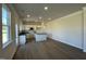 Bright and spacious kitchen with white cabinetry, a center island, and access to a dining area at 253 Deodora Ln, Cameron, NC 28326