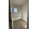 Laundry room features hard-wood flooring, window for natural light, and washer/dryer hookups at 253 Deodora Ln, Cameron, NC 28326