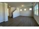 Spacious living room featuring hard surface flooring, modern lighting, and windows letting in natural light at 253 Deodora Ln, Cameron, NC 28326