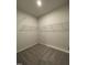 Spacious walk-in closet features carpet flooring and wire shelving for optimal storage space at 253 Deodora Ln, Cameron, NC 28326