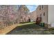 Backyard with mature trees, lawn, and a deck at 264 Farrington Dr, Clayton, NC 27520