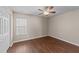 Bedroom with ceiling fan, window with blinds and wood-look flooring at 264 Farrington Dr, Clayton, NC 27520