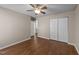 Bedroom featuring ceiling fan, modern closet, wood-look flooring and neutral paint at 264 Farrington Dr, Clayton, NC 27520