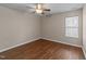 Bedroom with natural light through window, modern ceiling fan, and updated flooring at 264 Farrington Dr, Clayton, NC 27520