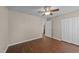 Bedroom featuring a ceiling fan, a door to the bathroom, and closet with modern flooring at 264 Farrington Dr, Clayton, NC 27520