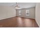 Spacious bedroom featuring hardwood floors and natural light from two windows at 264 Farrington Dr, Clayton, NC 27520