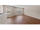 Open bonus room with two windows for lots of natural light, and hard surface flooring at 264 Farrington Dr, Clayton, NC 27520