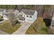 Charming two-story home featuring a welcoming porch, attached garage and a well-maintained lawn at 264 Farrington Dr, Clayton, NC 27520