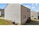 Rear exterior view of home with deck and walkout basement at 264 Farrington Dr, Clayton, NC 27520