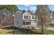 Charming two-story home with a well-maintained lawn, tree, and an inviting front porch at 264 Farrington Dr, Clayton, NC 27520