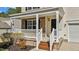 Inviting front porch with stone accents, white railings, and a cozy entrance to the home at 264 Farrington Dr, Clayton, NC 27520