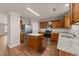 Bright kitchen with wood cabinets, stainless steel appliances, granite counters and a center island at 264 Farrington Dr, Clayton, NC 27520