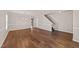 Spacious living room featuring hardwood floors, modern lighting, and neutral wall paint at 264 Farrington Dr, Clayton, NC 27520