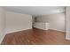 Spacious living room featuring wood-look flooring and neutral paint at 264 Farrington Dr, Clayton, NC 27520