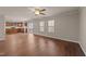 Open concept floor plan, living room featuring hardwood floors opening to kitchen area at 264 Farrington Dr, Clayton, NC 27520