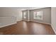 Bright living room featuring wood-look flooring and plenty of natural light at 264 Farrington Dr, Clayton, NC 27520