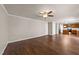 Open concept floor plan, living room featuring hardwood floors opening to hallway and kitchen at 264 Farrington Dr, Clayton, NC 27520