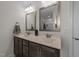 Bathroom featuring a double sink vanity, framed mirrors, and a glass enclosed shower at 277 Martins Mill Ct, Wendell, NC 27591