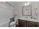 Bathroom featuring a shower/tub combo, toilet, and a single sink vanity at 277 Martins Mill Ct, Wendell, NC 27591