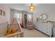 Bedroom featuring a crib, dresser, and a neutral color palette at 277 Martins Mill Ct, Wendell, NC 27591