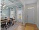 Inviting dining room featuring a coffered ceiling, updated light fixture, and natural light at 277 Martins Mill Ct, Wendell, NC 27591