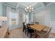 Bright dining room with stylish lighting and a beautiful ceiling design at 277 Martins Mill Ct, Wendell, NC 27591
