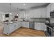 Well-appointed kitchen with granite counters, stainless appliances and ample cabinet space at 277 Martins Mill Ct, Wendell, NC 27591