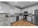 Modern kitchen featuring stainless steel appliances, granite countertops and ample storage at 277 Martins Mill Ct, Wendell, NC 27591