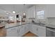 Open concept kitchen with granite countertops and stainless steel appliances at 277 Martins Mill Ct, Wendell, NC 27591