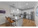Modern kitchen with granite countertops, stainless steel appliances, and breakfast bar at 277 Martins Mill Ct, Wendell, NC 27591