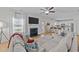 Relax in the bright living room with fireplace and open kitchen view at 277 Martins Mill Ct, Wendell, NC 27591