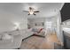 Cozy living room features a large sectional, fireplace, and natural light at 277 Martins Mill Ct, Wendell, NC 27591