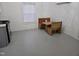 Eat-in kitchen area featuring a wood table with bench seating and white wall paneling at 301 Wilson St, Franklinton, NC 27525