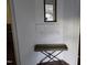 Cozy entryway featuring a small table, coat rack, and decorative mirror at 301 Wilson St, Franklinton, NC 27525