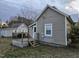 Charming home featuring a deck and neutral siding under a cloudy sky at 301 Wilson St, Franklinton, NC 27525