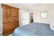Bedroom with neutral walls and ample closet space at 306 Village Orchard Rd, Cary, NC 27519