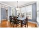 Bright dining room with large windows and hardwood floors at 306 Village Orchard Rd, Cary, NC 27519