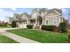 Beautiful two-story home with a covered porch and well-maintained lawn at 306 Village Orchard Rd, Cary, NC 27519