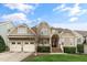 Charming home featuring a manicured lawn and inviting two-car garage at 306 Village Orchard Rd, Cary, NC 27519