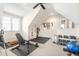Well-equipped home gym with weight rack, bench, and rubber floor at 306 Village Orchard Rd, Cary, NC 27519