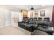 Movie room featuring a projector, comfortable seating, and a built-in wet bar for entertaining at 306 Village Orchard Rd, Cary, NC 27519