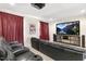 Inviting home theater with comfortable seating, projector, and large screen for ultimate entertainment at 306 Village Orchard Rd, Cary, NC 27519
