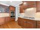 Gourmet kitchen features custom cabinets, granite countertops, stainless steel appliances, and hardwood floors at 306 Village Orchard Rd, Cary, NC 27519