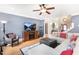 Cozy living room with a plush sectional and a ceiling fan at 306 Village Orchard Rd, Cary, NC 27519
